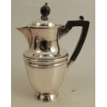 A silver hot water jug, with engraved initials, Sheffield 1902, weight 9oz all in, height 7.5ins