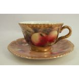 A Royal Worcester cup and saucer, decorated with fruit to a mossy background by P Love, dated