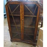 An Art Deco style oak display cabinet, together with a Globe Wernicke style bookcase