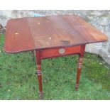 A 19th century mahogany Pembroke table, with drop flaps, with one real and one dummy drawers, raised