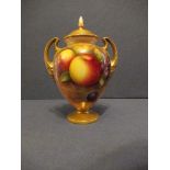 A Royal Worcester covered vase, decorated half round with hand painted fruit by Townsend, shape