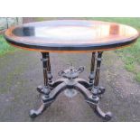 A Victorian oval centre table, the top with walnut, ebonised and burr wood band with leaf