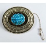 A Victorian turquoise cluster Etruscan style brooch, locket back, 4.4cm long, 17.3g gross