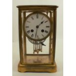 A 19th century four glass mantel clock, with white enamel dial, af, and mercury filled pendulum,