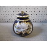 A Royal Crown Derby pot pourri vase and cover, painted with a landscape by F J Dean, to a cobalt