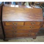 A 19th century mahogany bureau, the interior fitted with drawers and pigeon holes, over two short
