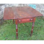 A 19th century mahogany Pembroke table, with drop flaps, with one real and one dummy drawers, raised