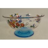 An early 20th century Stewart enamelled glass bowl, painted with panels of fruit on a blue glass
