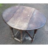 An oak gateleg table, with turned supports, 34ins x 27ins, height 26.5ins