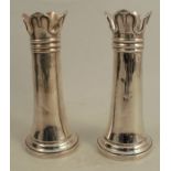 A pair of silver vases, with shaped and embossed edge, loaded bases, Sheffield 1905, height 6.5ins