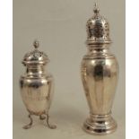 A silver sugar caster, Birmingham 1928, together with another sugar caster with engraved initials