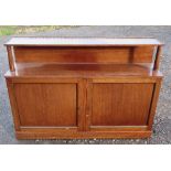 A mahogany cabinet, fitted with a shelf over with brass gallery supported by columns, the base