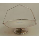 An octagonal silver pedestal dish, with swing handle, Sheffield 1920, weight 20oz