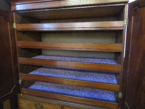 A 19th century mahogany linen press, the pair of cupboard doors with inlaid decoration, opening to - Image 3 of 3