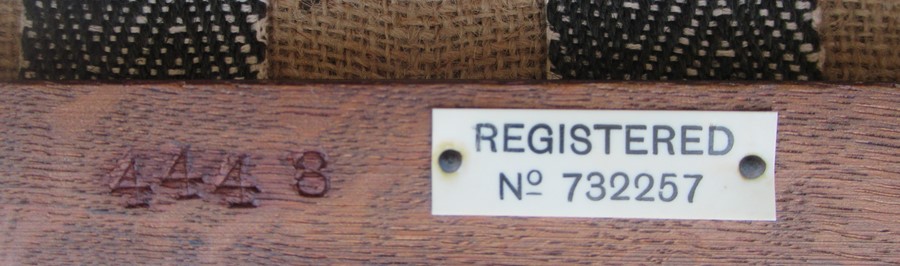 An oak monks seat, with pierced decoration to the slide top, upholstered seat, with plaque to - Image 3 of 3