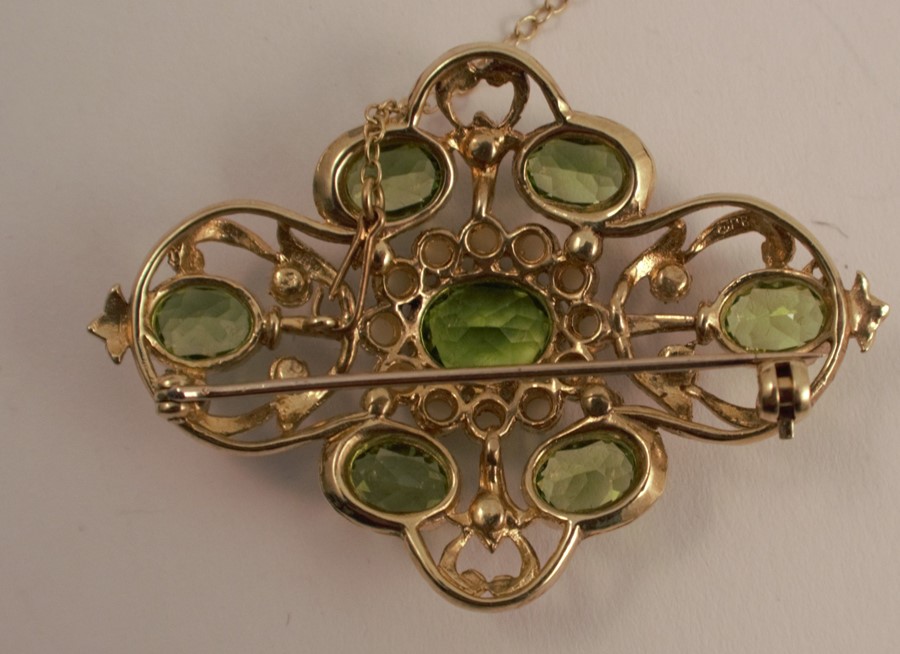 A peridot and cultured pearl Victorian style brooch, set with seven oval cuts, 4.9cm across, 11.7g - Image 2 of 3