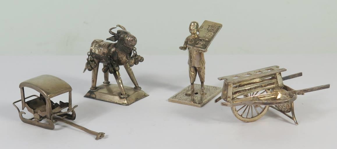 A Hong Kong Silver Miniature of a Single Wheel Barrow Wang Hing & Co., another of man with hand
