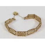 A 9ct Gold Gate Link Bracelet with heart clasp, 6.9g and box of odd costume