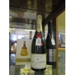 A Bottle of Moet & Chandon, Friexenet and empty Bells ceramic bottle