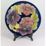 A Moorcroft Blue Ground Clematis Plate 26cm and box (box with fault to lid)