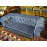 A Three Seater Chesterfield in blue dralon upholstery