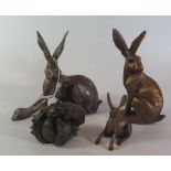 Three Bronzed Resin Hare Sculptures and one other