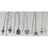 A Selection of Silver Mounted Pendant Necklaces including crosses