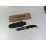 A CRKT First Strike Sheath Knife and three paper openers