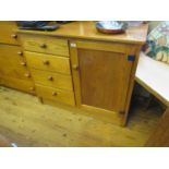 An Oak Cupboard with drawers to the side