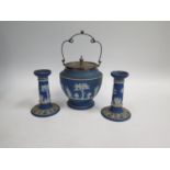 A Wedgwood Blue Jasper Biscuit Barrel with electroplated silver mounts and pair of candlesticks