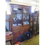A 19th Century Rosewood and Brass Strung Glazed Bookcase with secretaire and cupboards below