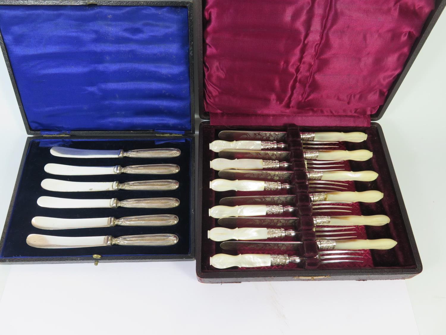 A Cased Set of Mother of Pearl Handled Fruit Knives and Forks and cased set of silver handled tea