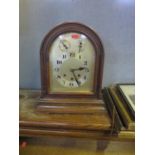 An Oak Cased Chiming Mantle Clock