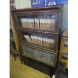 An Oak Four Tier Sectional Bookcase (base missing and other faults)