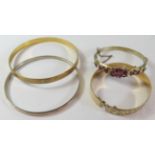 A 9ct Gold and Silver Bangle and three others