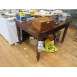 A Victorian Mahogany Table with turned legs