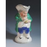 A 19th Century Staffordshire 'Snuff Taker' Toby Jug, 24cm, crazing