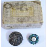 Two Arts & Crafts Brooches including one woth foliate enamel decoration and in a Liberty card box,