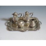 A Continental Silver Five Piece Tea Set including a tray, engraved with coat of arms and scroll