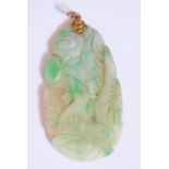 A Chinese Carved and Pieced Jadeite Pendant decorated with fenghuang and with a yellow metal