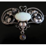 An Arts & Crafts Silver and White Opal Mounted Brooch, 41mm diam., 5.7g