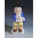 A Nineteenth Century Samson Porcelain Toby Jug, gilt anchor mark, 25cm, hairline to base and glaze