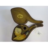 A Peterson's Patent Meerschaum Pipe decorated with the bust of a moustached man: COMICAL CHRIS (an