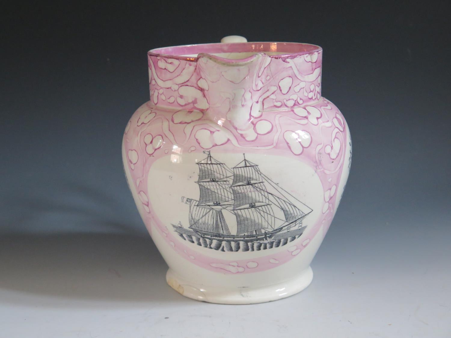 A Sunderland Lustre Jug with monochrome decoration of a three masted ship and flanked by poetic