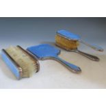 A George V Silver and Blue Guilloché Enamel Five Part Dressing Table Mirror and Brush Set, London