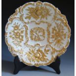 A Nineteenth Century Meissen Gilt and White Porcelain Shallow Dish with moulded foliate