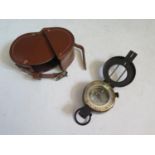 A Post WWII Marching Compass in leather pouch, no markings