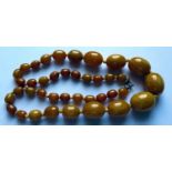 A Graduated Faux 'Baltic' Amber Bead Necklace, 69cm, 88.8g