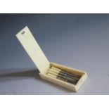 An Early 20th Century Ivory Cased Manicure Set, 8.5cm long