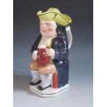 A 19th Century Toby Jug with cover, 25cm, two small chips to rim, firing crack to handle and tight